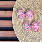 گیره-موی-پاپیونی-دخترانه-طرح-گل-حریر-صورتی